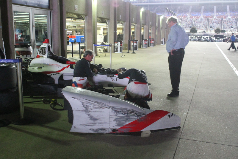 One deeply angry Dale Coyne (in the light blue shirt) surveys Vautier’s car.